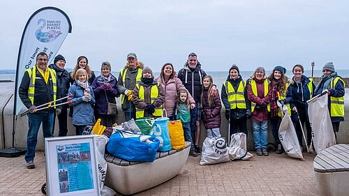 Photo of volunteer beach clean up crew