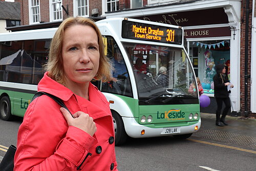 Helen Morgan with a local bus