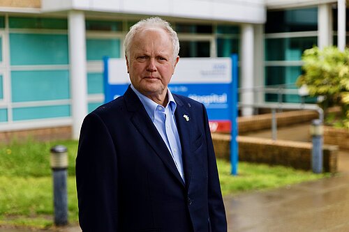 Clive Jones outside Royal Berkshire Hospital, frowning